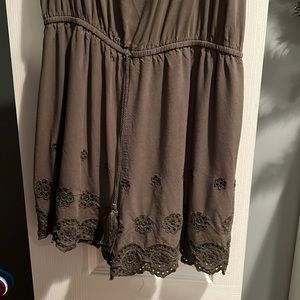 green romper with flower designs